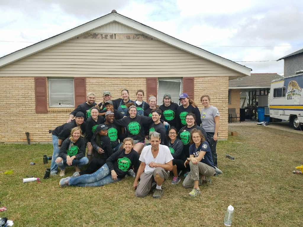 Stevenson University volunteers in front of a home they're helping restore with SBP in New Orleans.